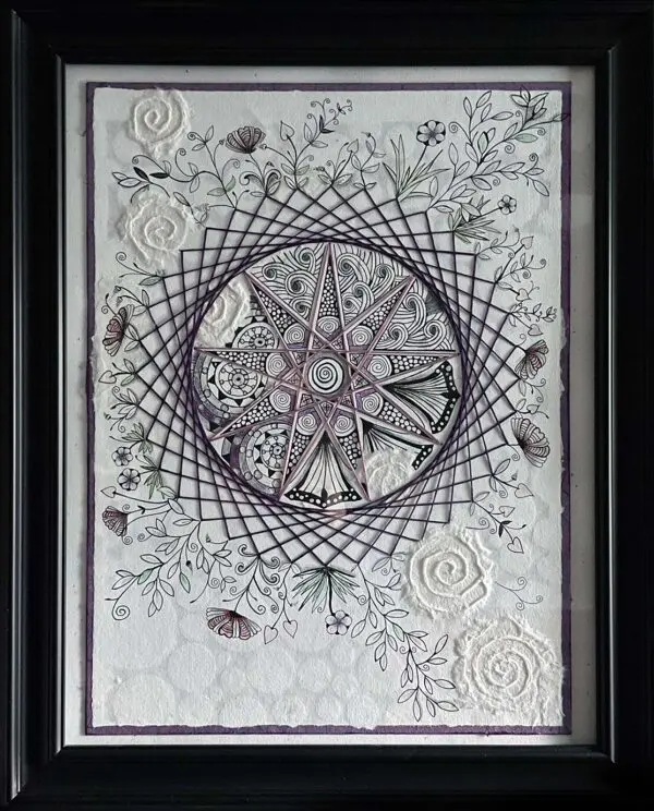 Framed string art with floral details.