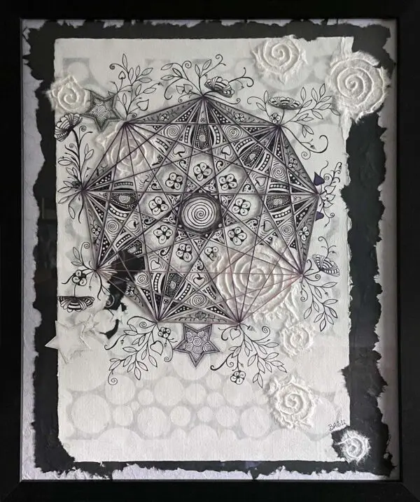 Framed black and white geometric art.