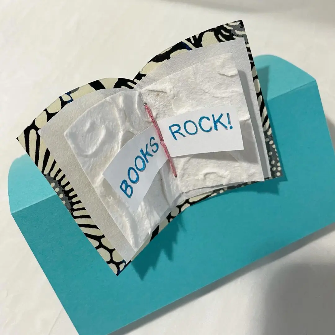 Small book with "Books Rock!" text.