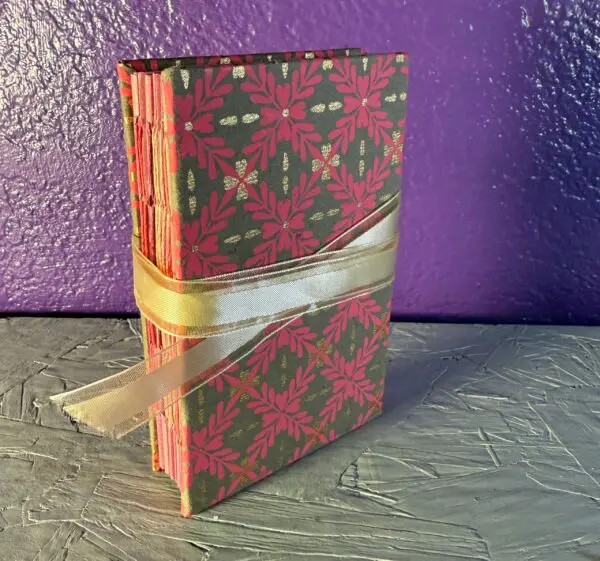 A book with a ribbon wrapped around it.