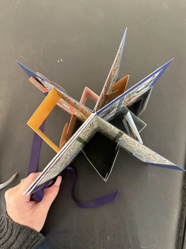 Pop-up book with colorful pages displayed.