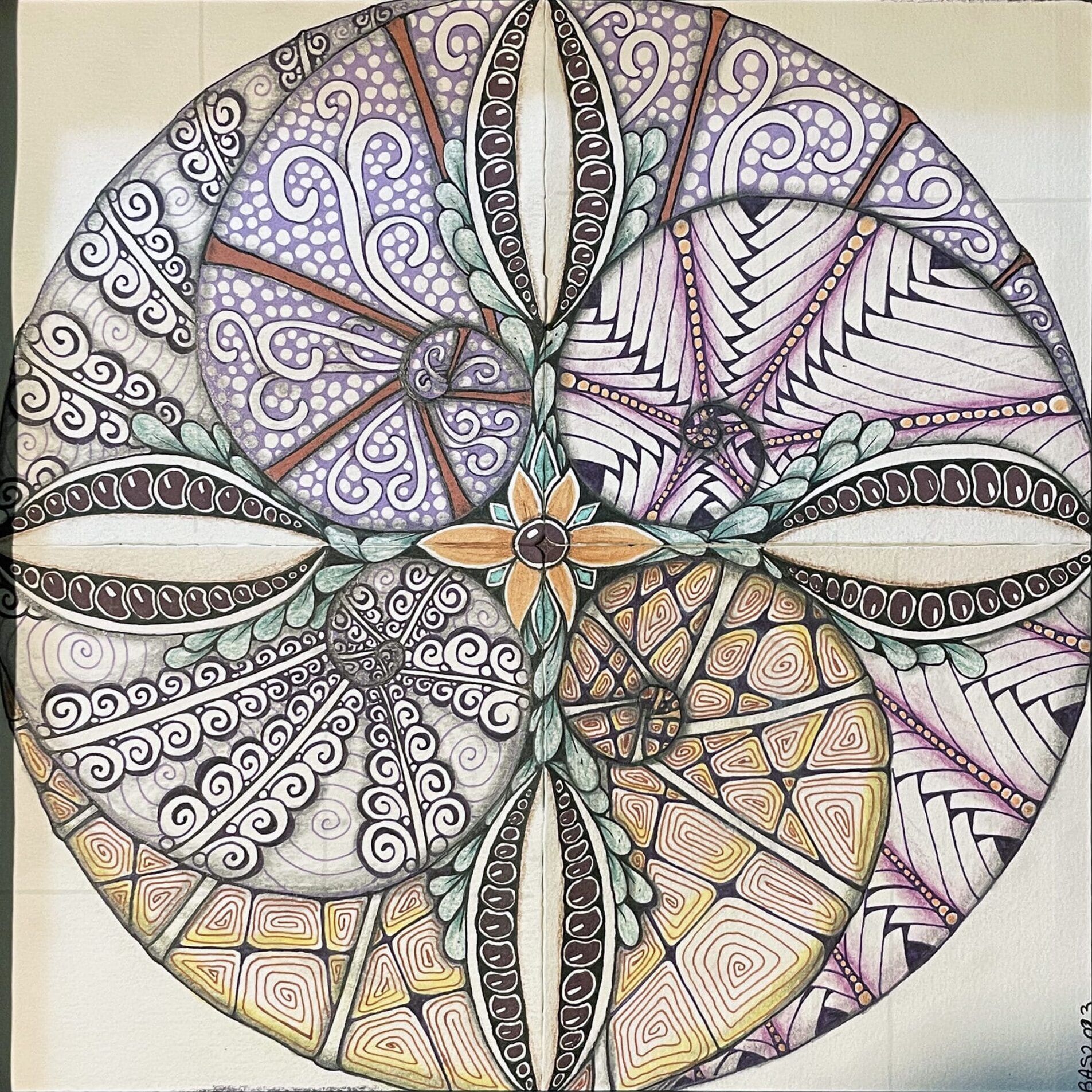 A circular drawing of different designs on paper.